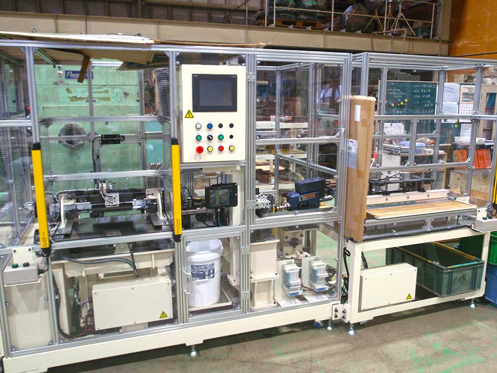 バックチェック挽割穴あけ機